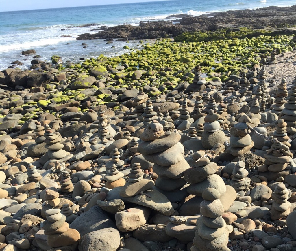 The pebble towers were waiting to be embraced by the white waves